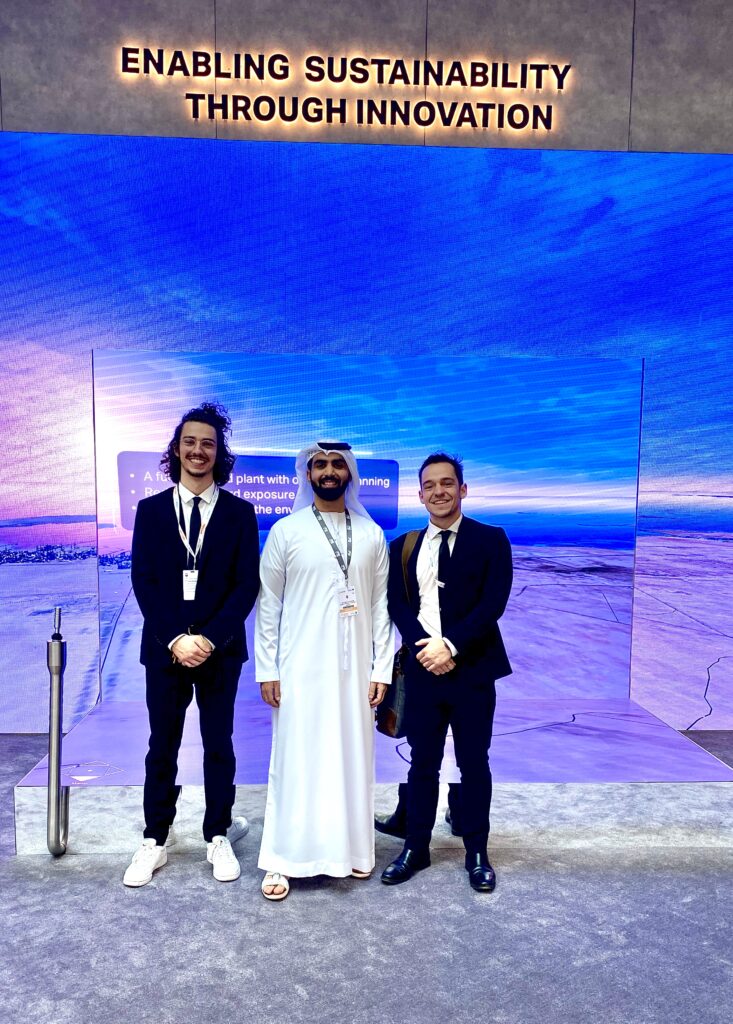 Green New World's co-founders John Touloupis & Alexios Touloupis standing with a stake holder of UAE during an event regarding Sustainability through Innovation